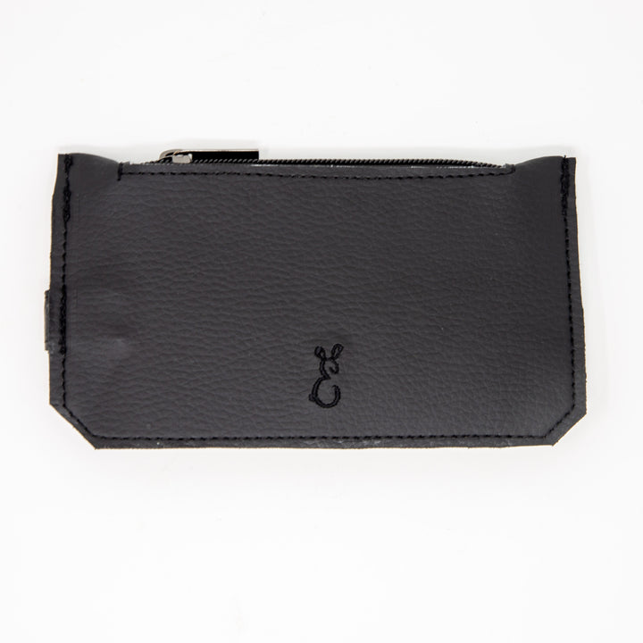 Back of black slim purse showing embroidered logo and zipped pocket section