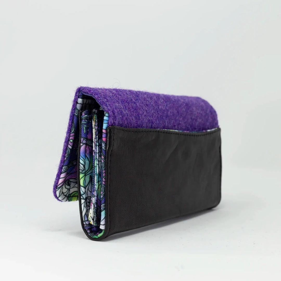 Side view of Aurora leather and Harris Tweed® purse showing structured profile