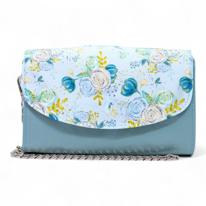 Eira leather mini handbag in powder blue and floral flap design, featuring a silver chain strap and compact handcrafted silhouette.