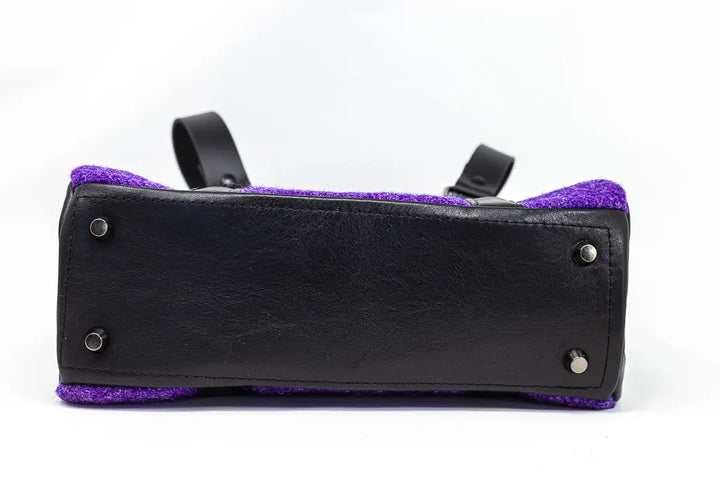 ase of the Rowena handbag in purple Harris Tweed® with black leather bottom panel, handcrafted in Wales by Emma Easter Handcrafted.
