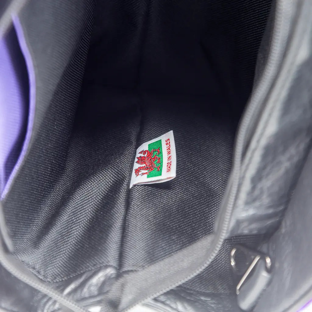 Interior of the Rowena handbag showing made in Wales label and water-resistant lining, crafted by Emma Easter Handcrafted in Wales.