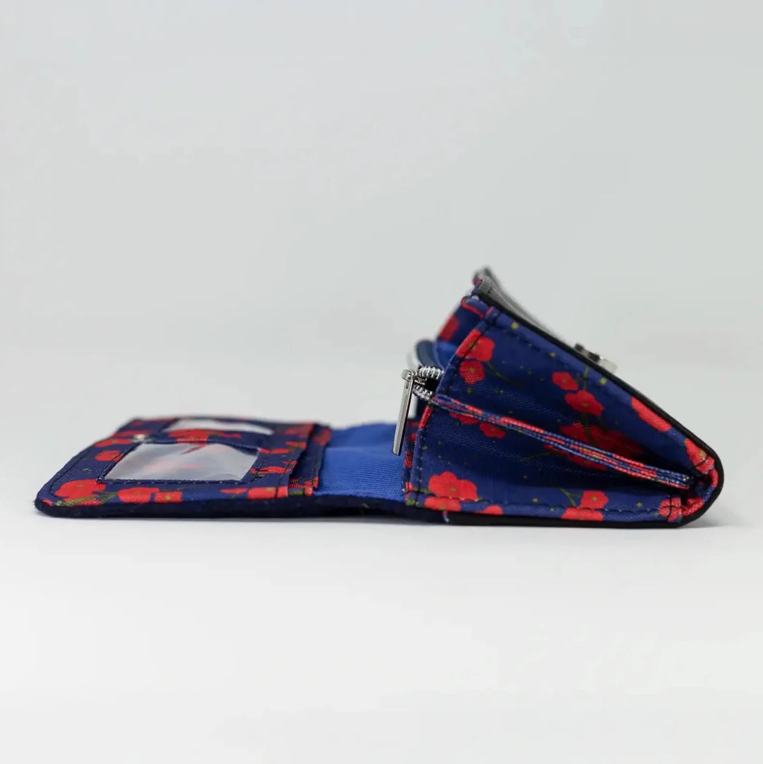 Side view of Navy Poppy purse opened to show structured interior compartments