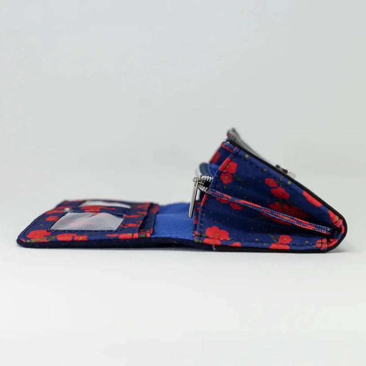 Side view of Navy Poppy purse opened to show structured interior compartments