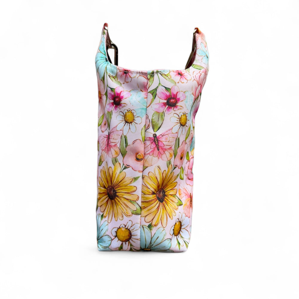 Back view of the Penelope Bottle Buddy showcasing vibrant floral design on durable water-resistant canvas