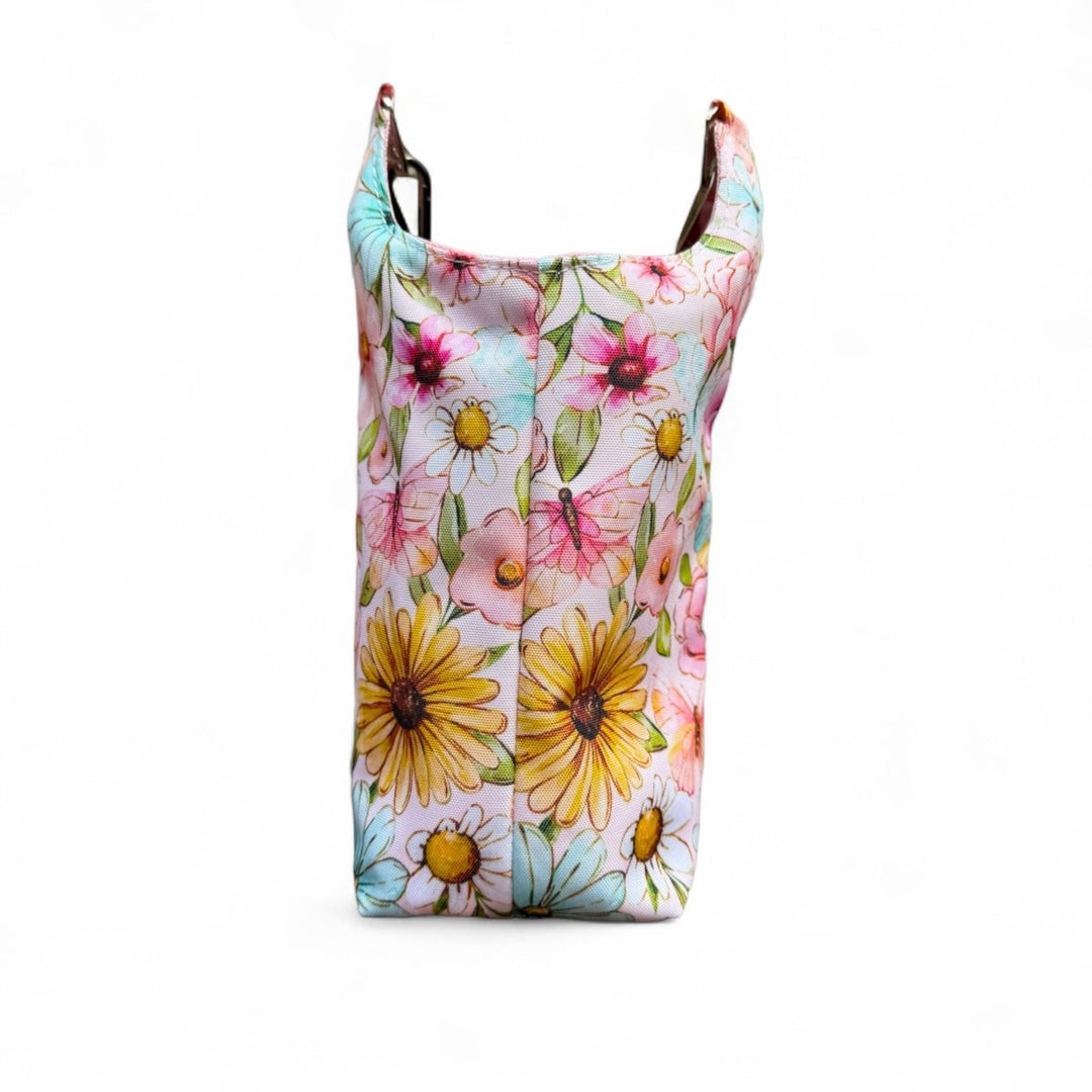 Back view of the Penelope Bottle Buddy showcasing vibrant floral design on durable water-resistant canvas
