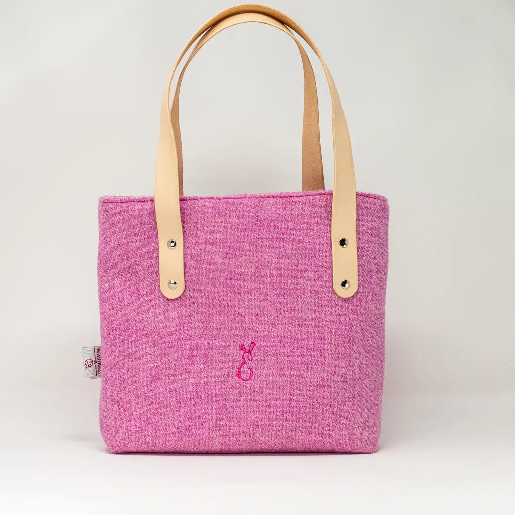 Front view of the Penelope Harris Tweed pink tote bag with natural leather handles, handcrafted in Wales by Emma Easter