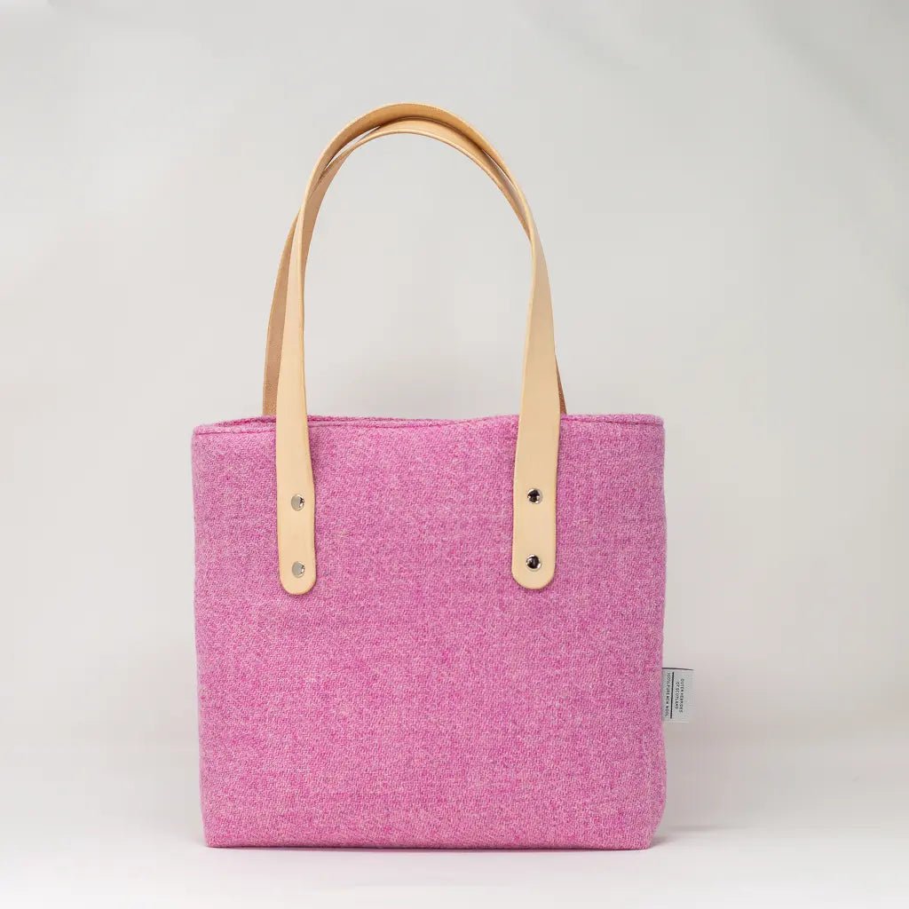 Back view of the Penelope Harris Tweed pink tote bag showing Harris Tweed fabric and leather handles by Emma Easter.