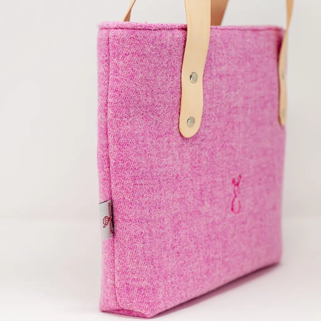 Side view of the Penelope Harris Tweed pink tote bag with Harris Tweed label and leather strap detail by Emma Easter.