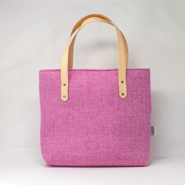 Full back view of the Penelope Harris Tweed pink tote bag with natural leather handles by Emma Easter.