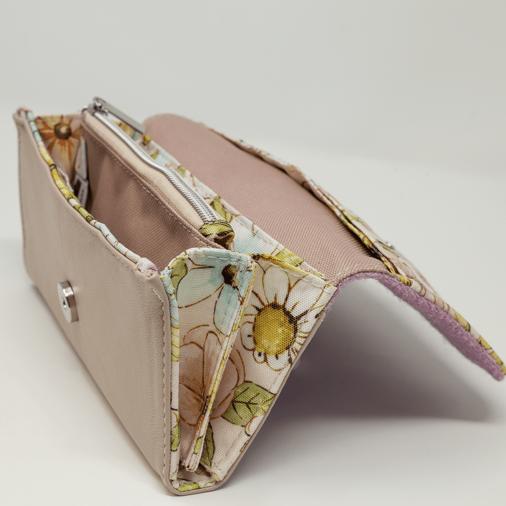 Side view of Penelope purse showing Harris Tweed® and butterfly lining detail