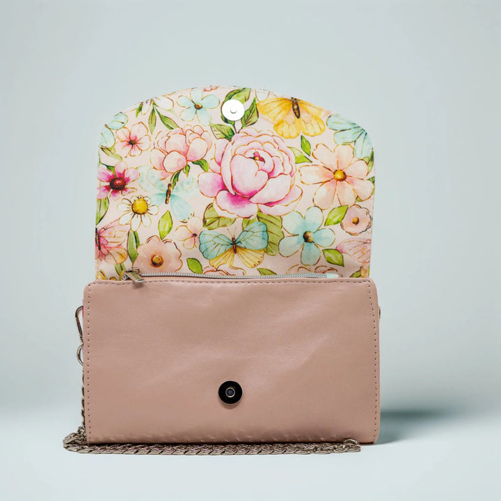 Floral-patterned clutch with a pastel pink leather base by Emma Easter handcrafted