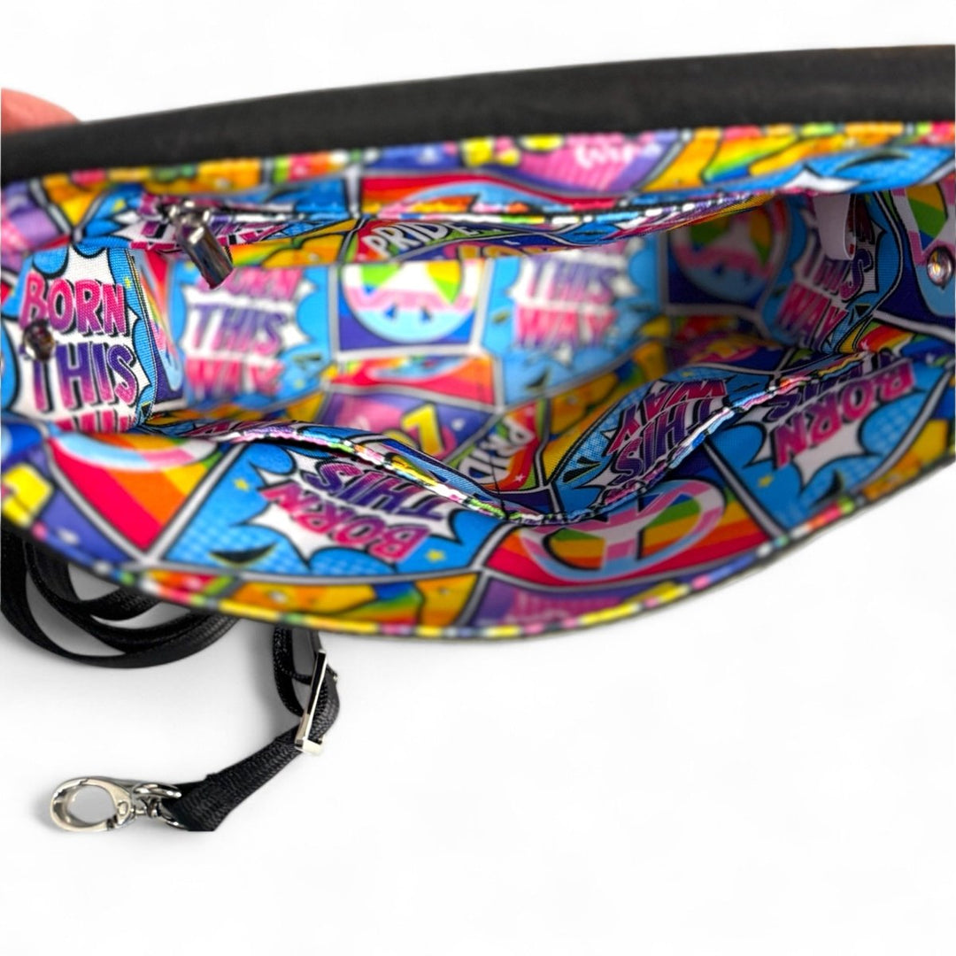 Pop Pride crossbody bag interior showing water-resistant printed lining with comic book Pride design