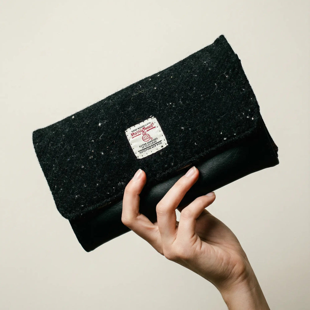 Hand holding Rosa Harris Tweed® and leather purse, handcrafted in Wales