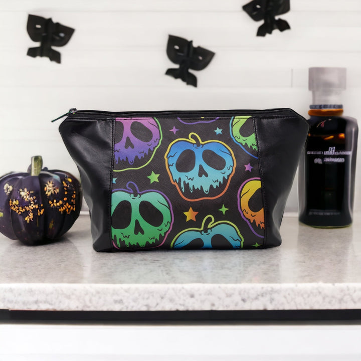 Spooky Apples Makeup Bag on a bathroom shelf surrounded by spooky ornaments - Emma Easter Handcrafted